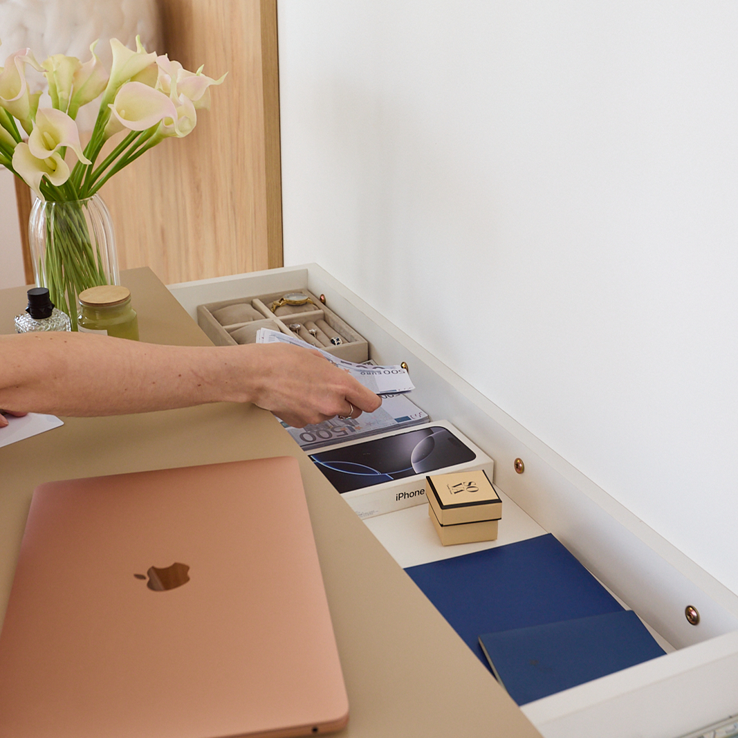 Close-up of A14 concealed storage drawer with valuables and personal belongings