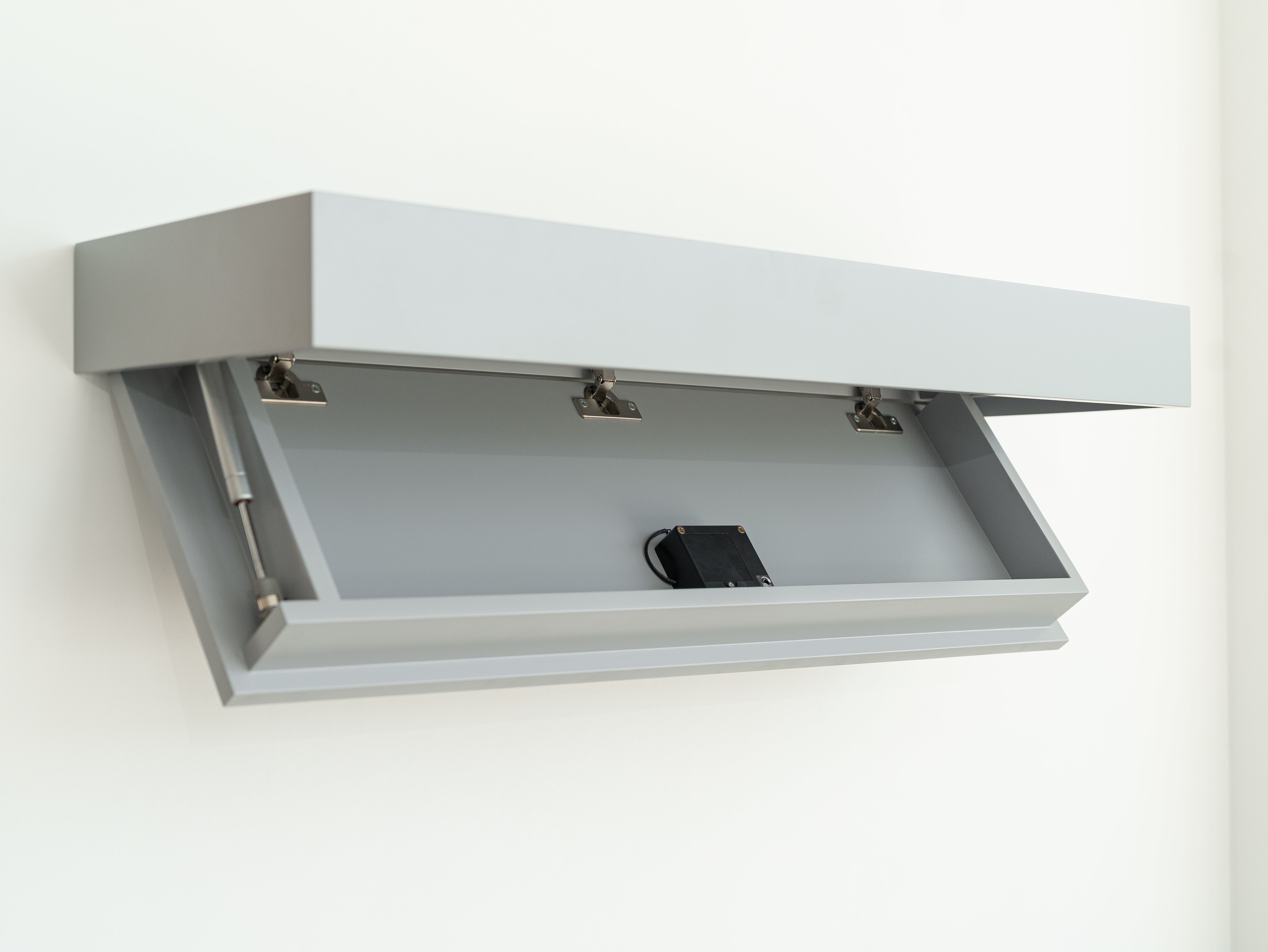 Gray wall-mounted shelf drawer with a RFID lock on a white background
