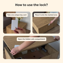 Three-panel instructional graphic showing how to use a lock key card: taking a white key card, placing it on a wooden table, and opening a hidden safe compartment under a wooden surface. Text labels guide each step.