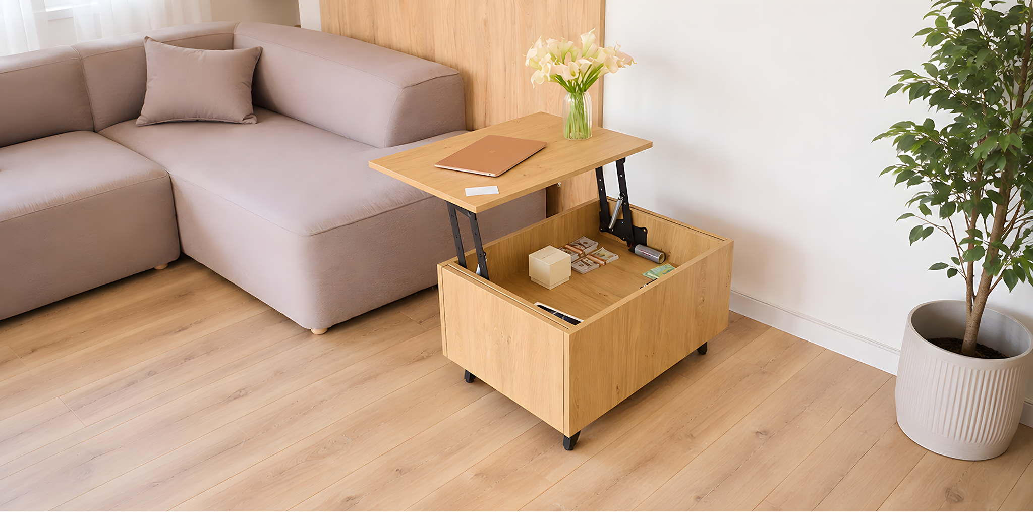 A light wood lift-top coffee table with a built-in storage compartment and black caster wheels, shown in a modern living room next to a beige sectional sofa and a potted plant