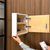 Close-up of concealed storage compartment behind fishing wall art with shelves for cash and documents