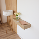 A14 floating console table in beige finish mounted in a modern bedroom interior