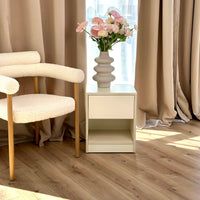 B28 modern nightstand in a light interior with main drawer, open shelf and concealed lower storage.