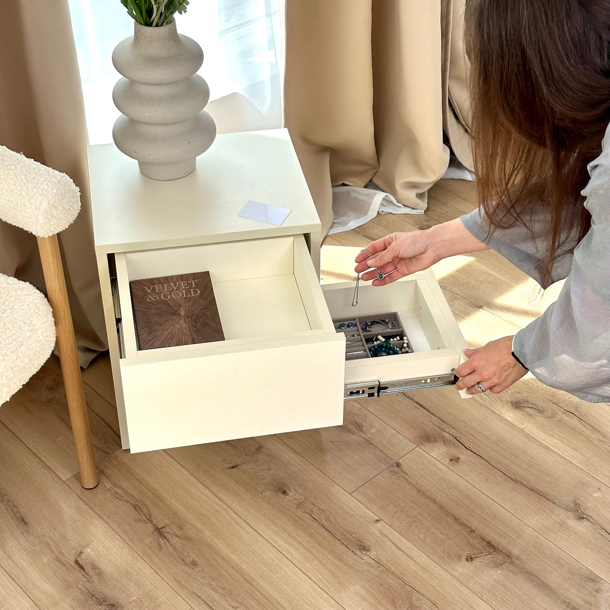 B28 nightstand with main drawer and side hidden drawer open for jewellery and small valuables.