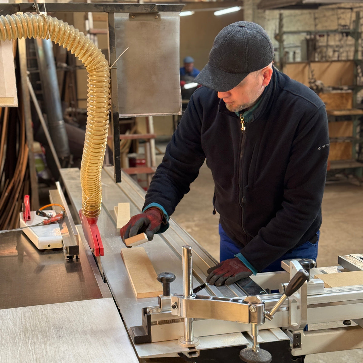 Hiddo craftsman working on furniture production inside the workshop