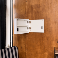 Side view of white D01 wall art opened to reveal the hidden compartment and concealed locking mechanism.