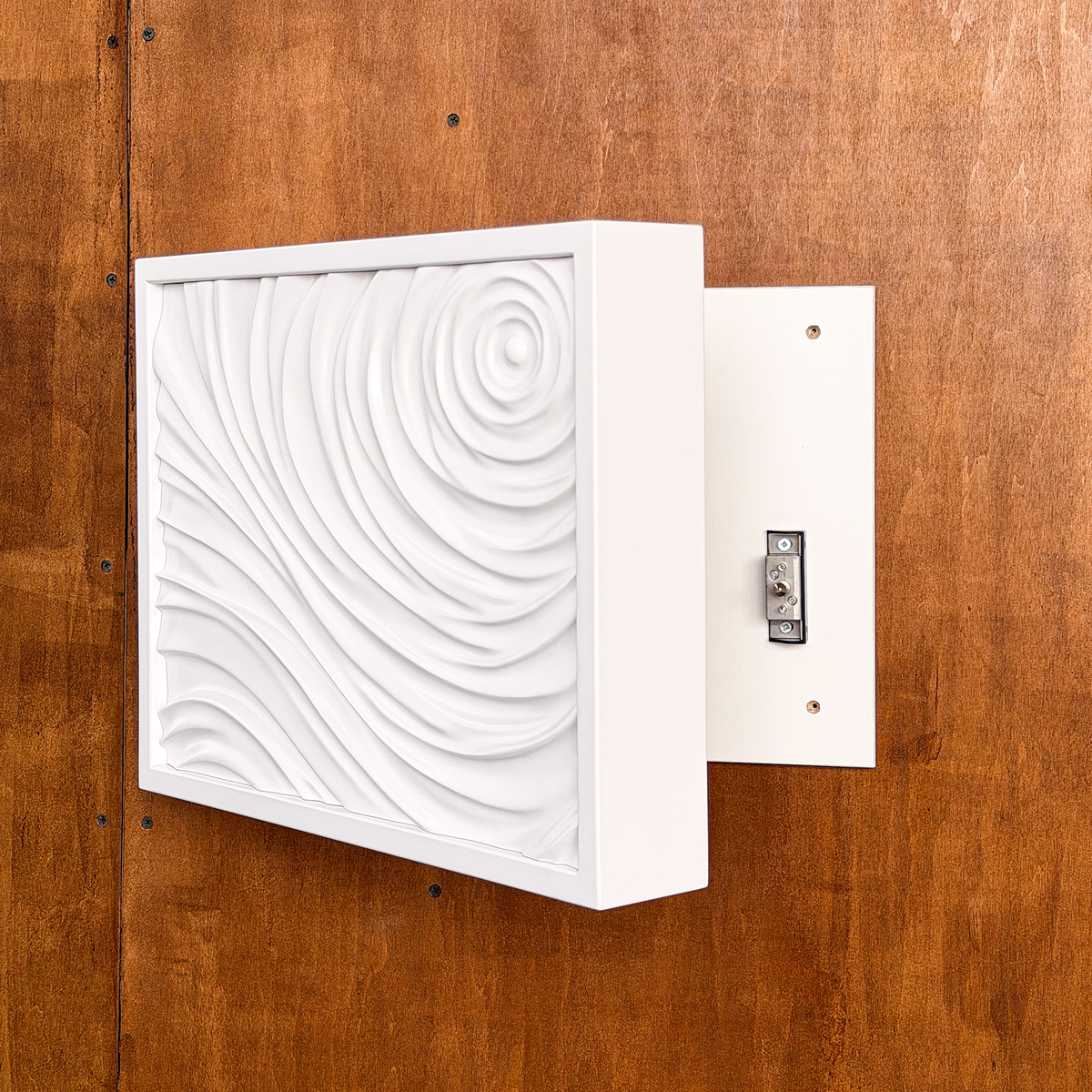 Side view of white D01 wall art opened to reveal the hidden compartment and concealed locking mechanism.
