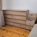 White Hiddo nightstand B28 with a drawer and open lower shelf between two beds